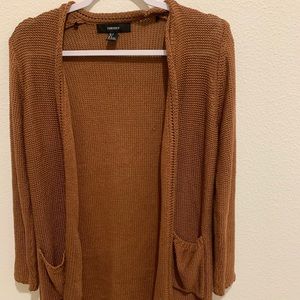 A amber color cardigan